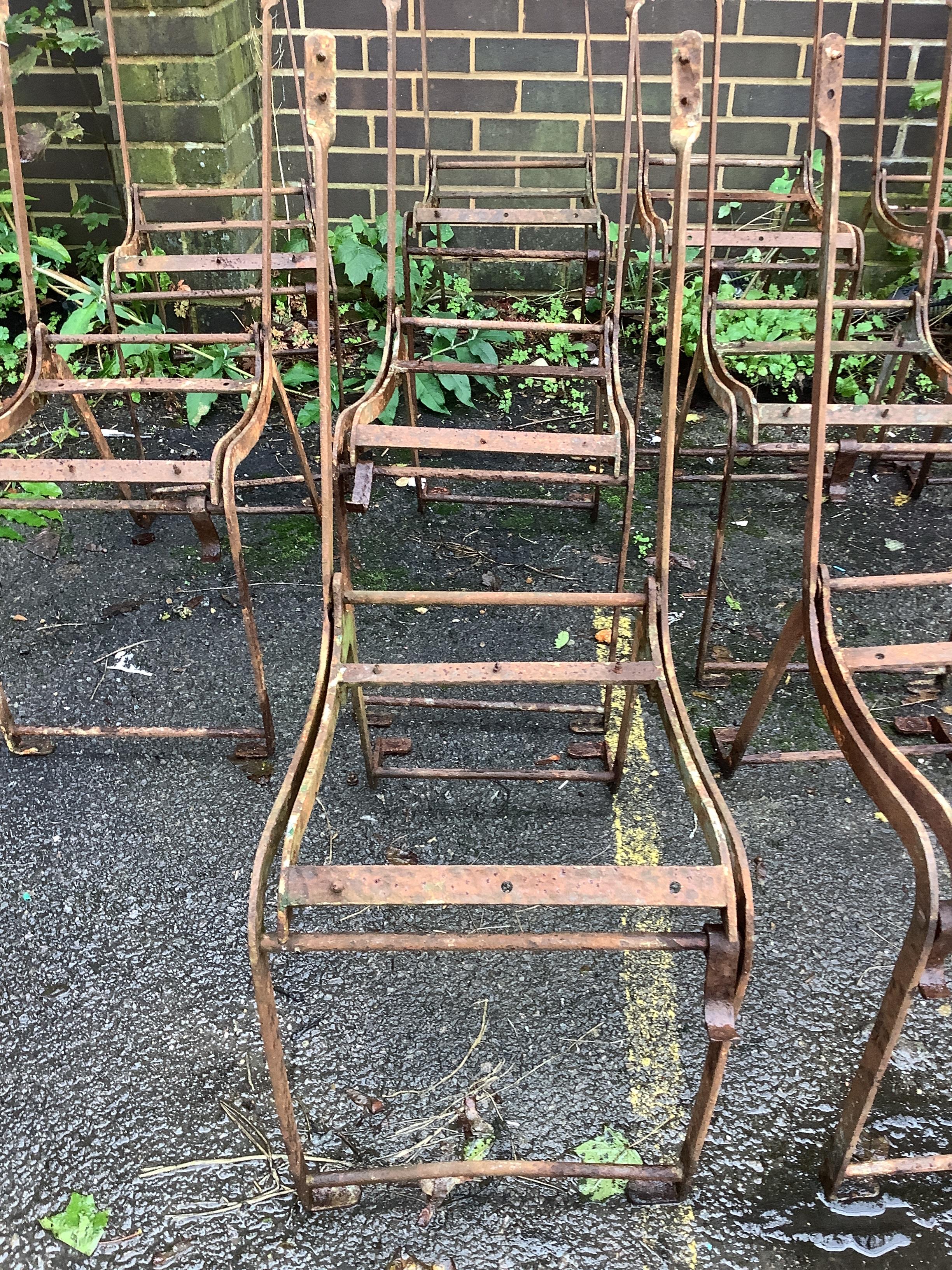 A set of ten metal folding garden chair frames